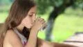 Girl drinks water from a glass HD Footage
