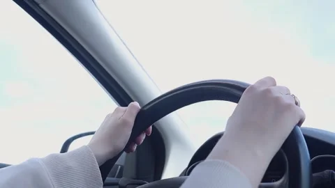 The girl driver gets angry while driving the car and hits the steering wheel. Stock Footage 275459479