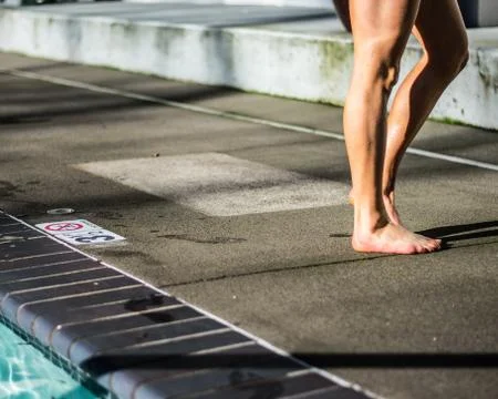 Girl drying off by the pool Stock Photos