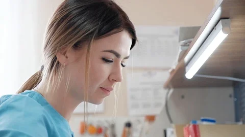 Girl on duty paramedic while working at the desk Stock Footage 106447293