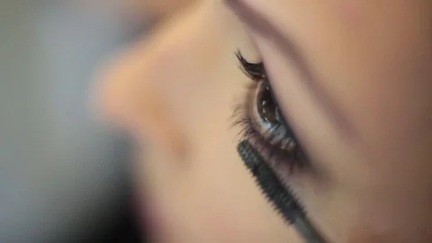 Girl dye eyelashes close up Stock Footage 73604471
