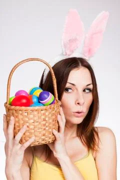 Girl with easter egg basket Stock Photos
