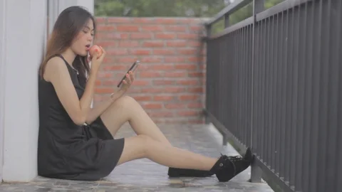 Girl Eat Apple While Read Cell Phone Stock Footage 122065898