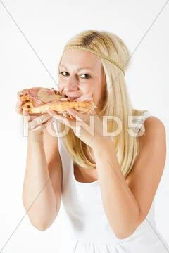 Girl eating fast food pizza Stock Photos