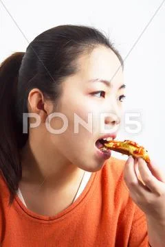 Girl eating pizza Stock Photos