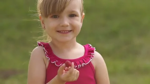 Girl eating raspberry Video stock 11317375