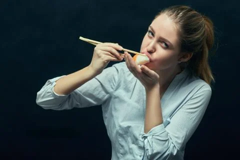 Girl eating sushi Foto stock