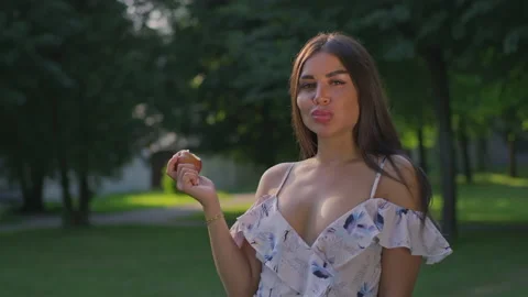  A girl eats an apple Stock Footage 156508797