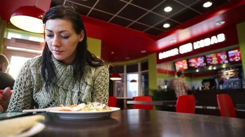 Girl eats in cafe Video stock 45798591