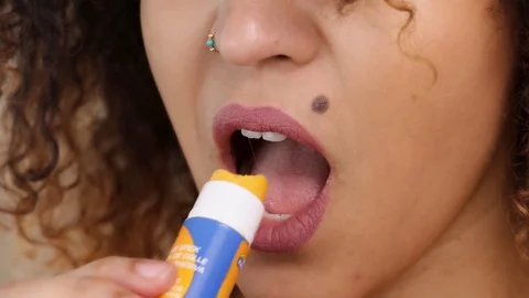 Girl Eats Cheese From Glue Stick Closeup Видео 87854260