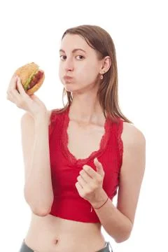 Girl eats cheeseburger Photos