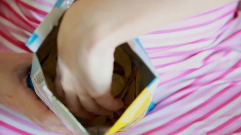 The girl eats chips Stock Footage 92662526