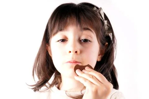 Girl eats chocolate Stock Photos