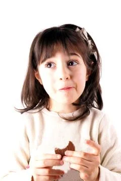 Girl eats chocolate Stock-Fotos