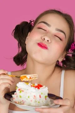 Girl eats dessert Stock Photos