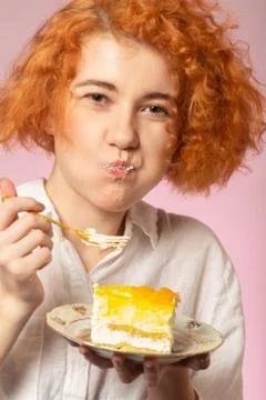 Girl eats dessert Фото