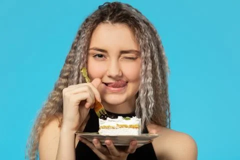 Girl eats dessert Фото