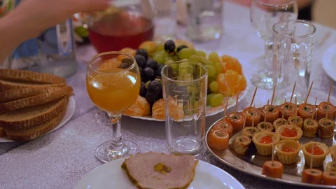 The girl eats fruit. New Year's party or wedding banquet. Stock Footage 100347322