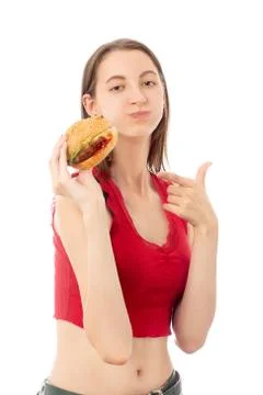 Girl eats hamburger Stock Photos