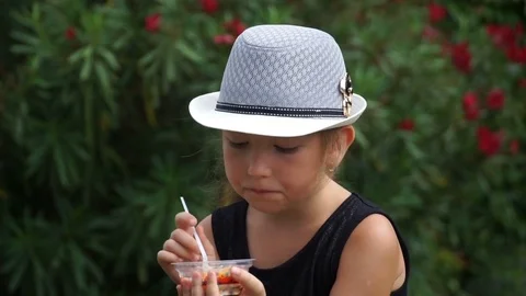 Girl eats ice cream Video stock 84708725