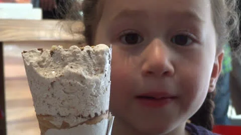 Girl eats icecream 2 Stock-Footage 22561394