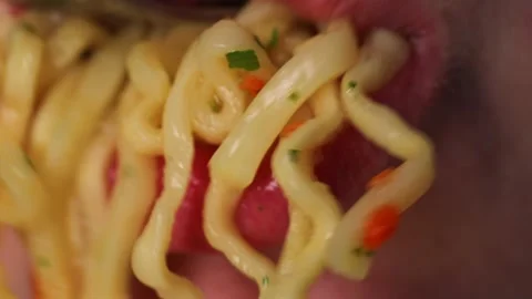 Girl eats instant noodles. fast food. pasta with spices Stock Footage 237456390