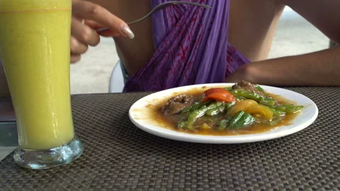 Girl eats meat with vegetables Stock Footage 91368157