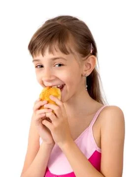 The girl eats a patty Stock Photos