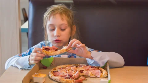 The girl eats pizza Stock Footage 142398209