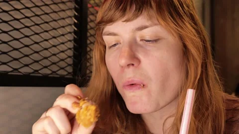 Girl eats in a restaurant. close-up Stock Footage 171884228