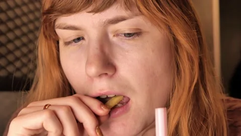 Girl eats in a restaurant. close-up Stock Footage 193898401