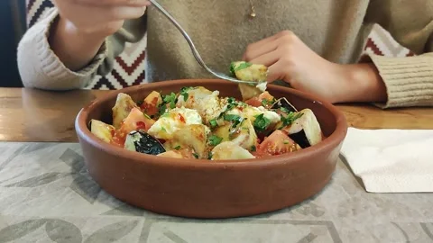 A Girl Eats Salad With A Fork From A Plate. Close Up Shot Video Stock Footage 298284927