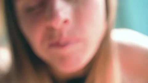 The girl eats, sticking a fork into the vegetables and enjoying every bite. Stock Footage 234021256