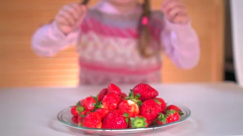 Girl eats strawberry Video stock 131556956