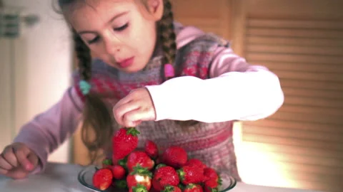 Girl eats strawberry Video stock 131556974