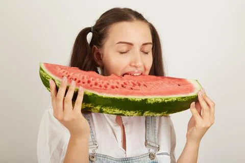 Girl eats watermelon Фото