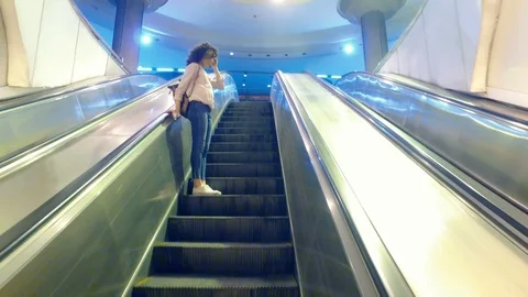 Girl on the elevator in an empty subway Stockbeeldmateriaal 96349104