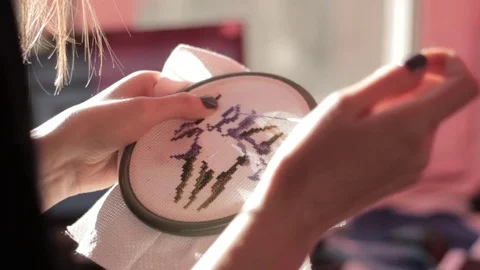 Girl embroider patterns Stock Footage 76988045