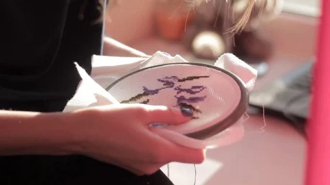 Girl embroider patterns Stock Footage 76988231
