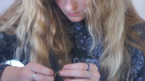 The girl is engaged in needlework Stock Footage 93179031