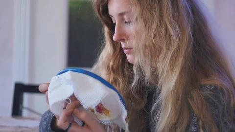 The girl is engaged in needlework Stock Footage 93179183