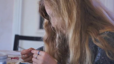 The girl is engaged in needlework Stock Footage 93179210