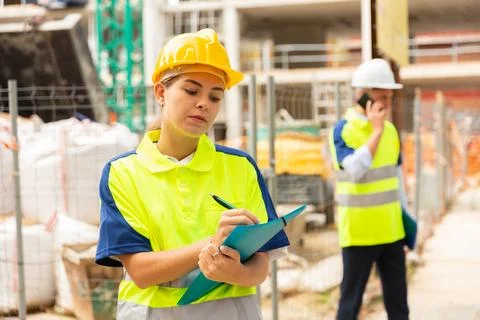 Girl engineer checking work process Stock Photos