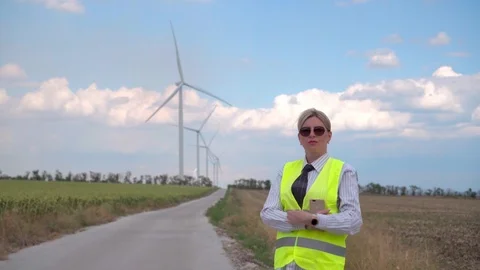 Girl engineer controls the work of wind generators Stock Footage 114511254