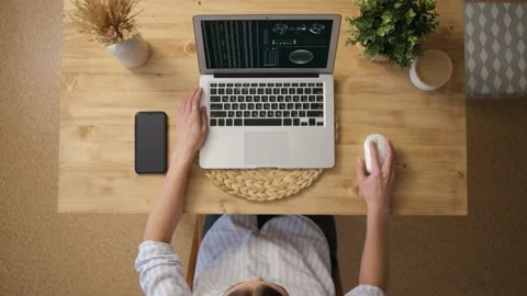 The girl is an engineer working on a laptop. Graphs and scales. Technological pr Stock Footage 150194945