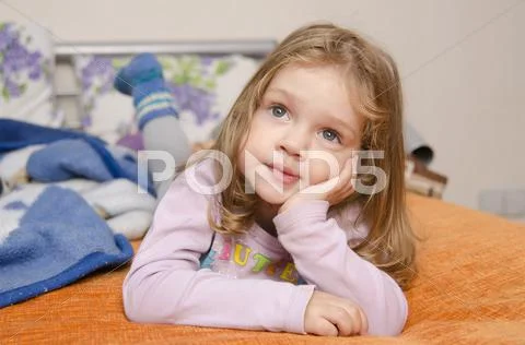 Girl enthusiastically watching tv Stock Photos