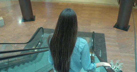 Girl on Escalators in a Mall Video stock 109535528