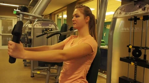 GIrl exercising with machine Stock Footage 45523494