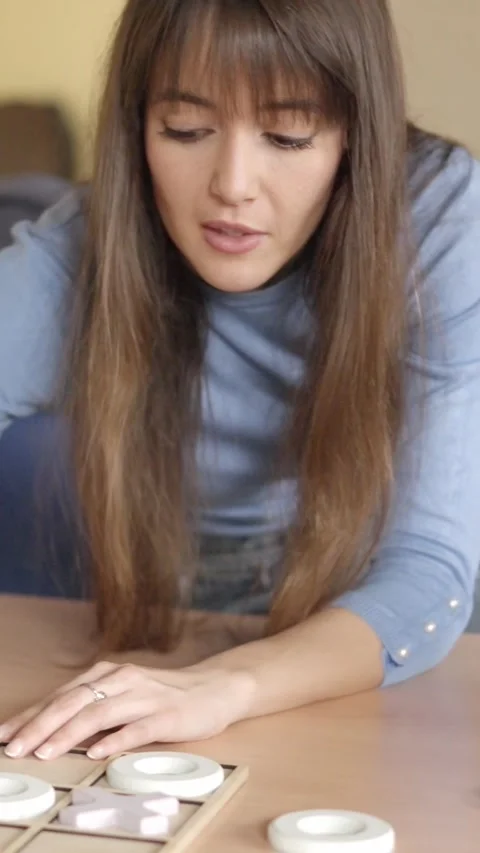 Girl explaining rules of a game to a senior man Stock Footage 269760547