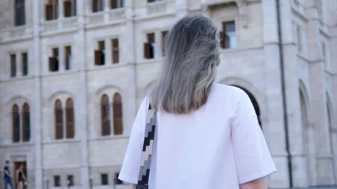 Girl explores Budapest square Stock Footage 283631179
